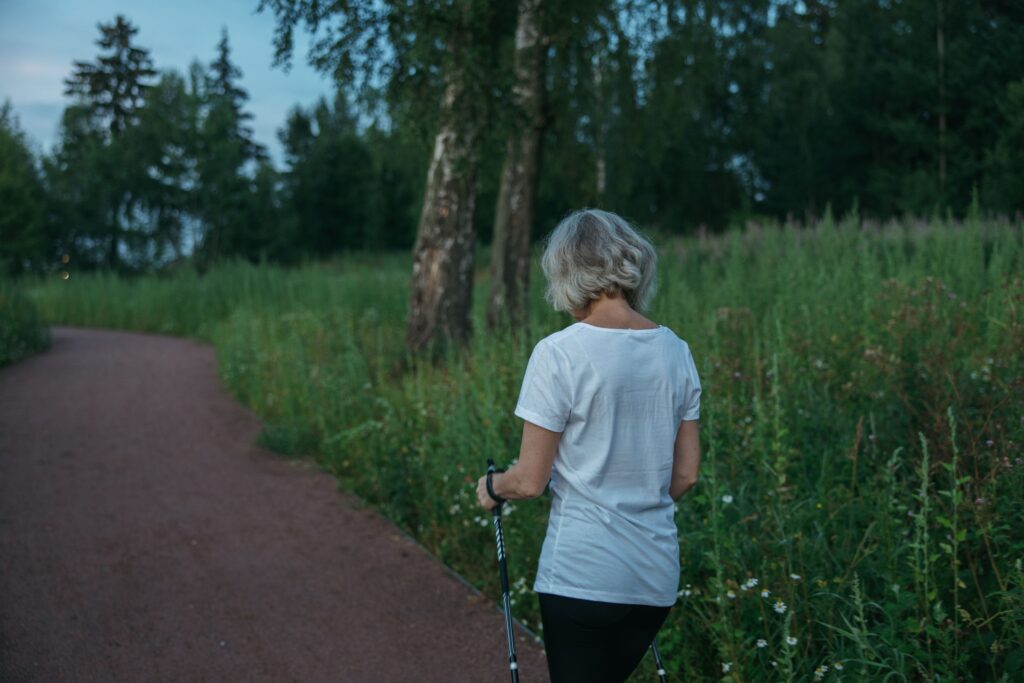 Older woman walking outdoors as part of an active lifestyle